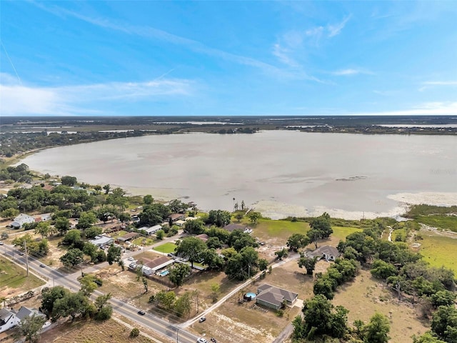 birds eye view of property featuring a water view and a residential view