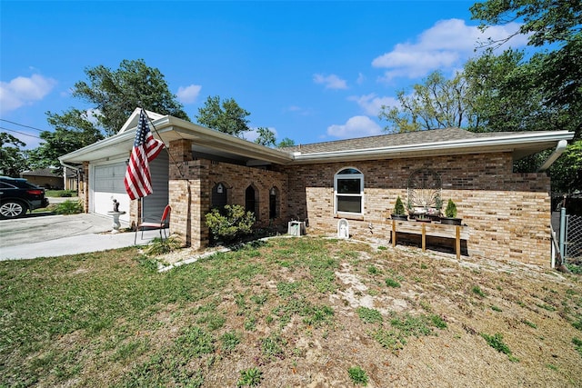 1399 Leeward Ave, Spring Hill, FL 34606 - view of front of home with concrete driveway, an attached garage, brick siding, and a front yard