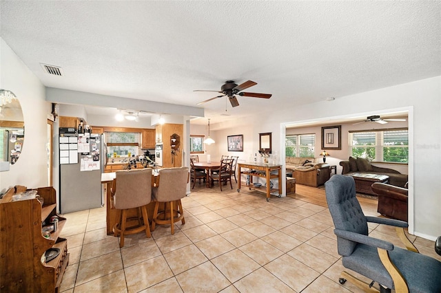 1399 Leeward Ave, Spring Hill, FL 34606 - dining area with a ceiling fan, visible vents, and light tile patterned flooring