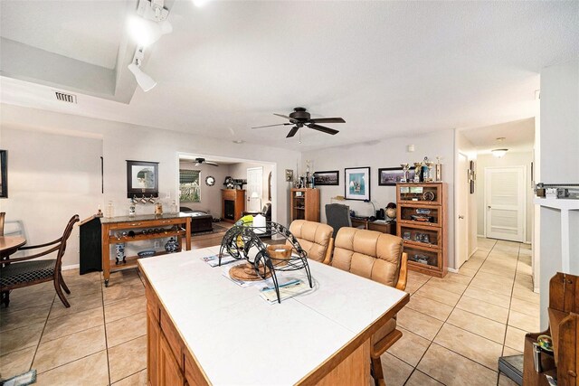 1399 Leeward Ave, Spring Hill, FL 34606 - kitchen featuring tile counters, visible vents, light tile patterned floors, and a ceiling fan