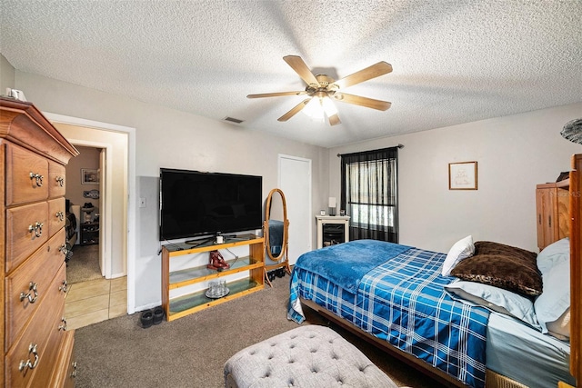 1399 Leeward Ave, Spring Hill, FL 34606 - carpeted bedroom with a textured ceiling, visible vents, and ceiling fan
