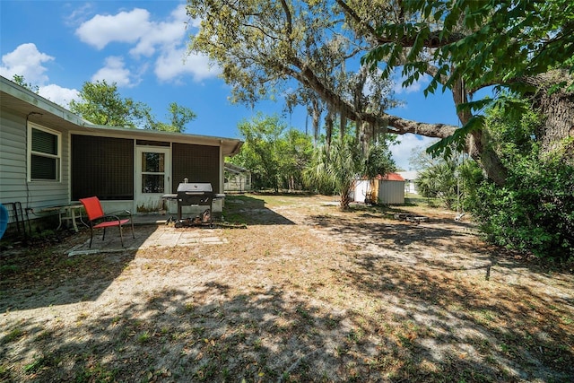 1399 Leeward Ave, Spring Hill, FL 34606 - view of yard featuring a storage unit and an outdoor structure