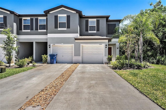 23378 Papyrus Way, Lutz, FL 33549 - view of front of home featuring stucco siding, concrete driveway, and a garage