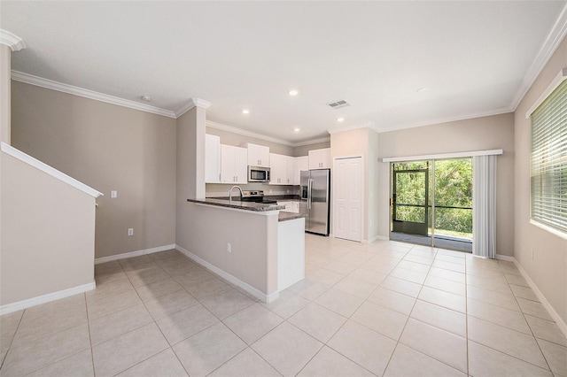 23378 Papyrus Way, Lutz, FL 33549 - kitchen with a peninsula, visible vents, appliances with stainless steel finishes, and light tile patterned floors