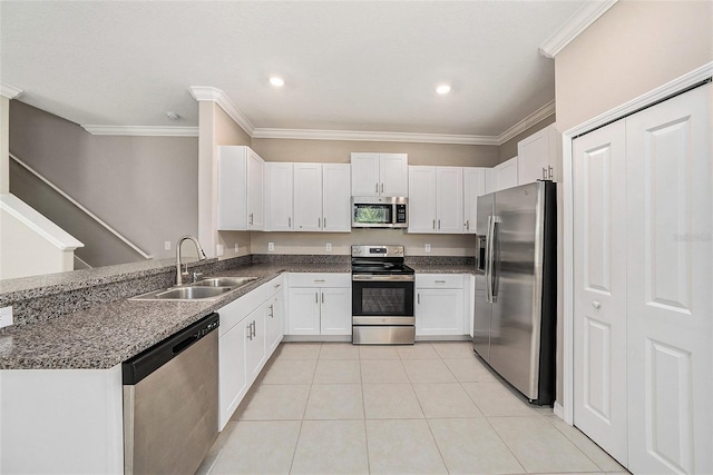 23378 Papyrus Way, Lutz, FL 33549 - kitchen featuring ornamental molding, a sink, white cabinetry, and appliances with stainless steel finishes