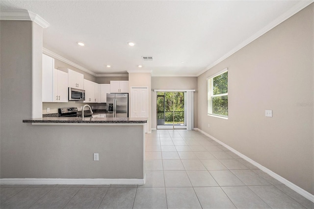 23378 Papyrus Way, Lutz, FL 33549 - kitchen featuring baseboards, visible vents, white cabinetry, appliances with stainless steel finishes, and light tile patterned floors