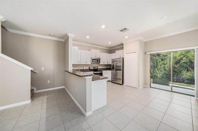 23378 Papyrus Way, Lutz, FL 33549 - kitchen featuring a peninsula, visible vents, white cabinetry, appliances with stainless steel finishes, and light tile patterned floors