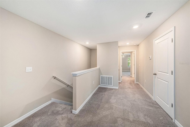 23378 Papyrus Way, Lutz, FL 33549 - hallway with an upstairs landing, visible vents, and carpet