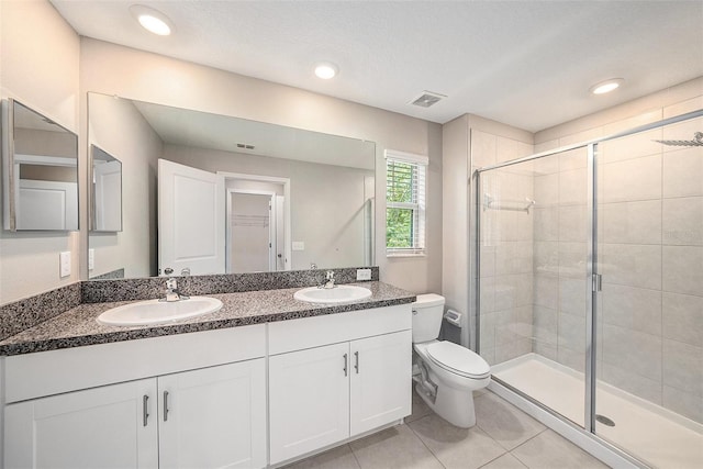 23378 Papyrus Way, Lutz, FL 33549 - bathroom with tile patterned flooring, a sink, a shower stall, and toilet