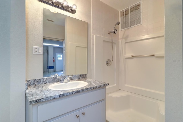 5449 Manatee Point Dr, New Port Richey, FL 34652 - bathroom featuring vanity and a shower