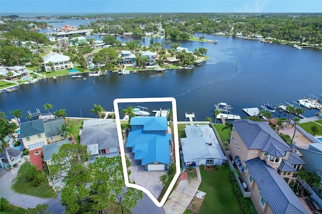 5449 Manatee Point Dr, New Port Richey, FL 34652 - aerial view of residential area with a large body of water and property boundaries highlighted