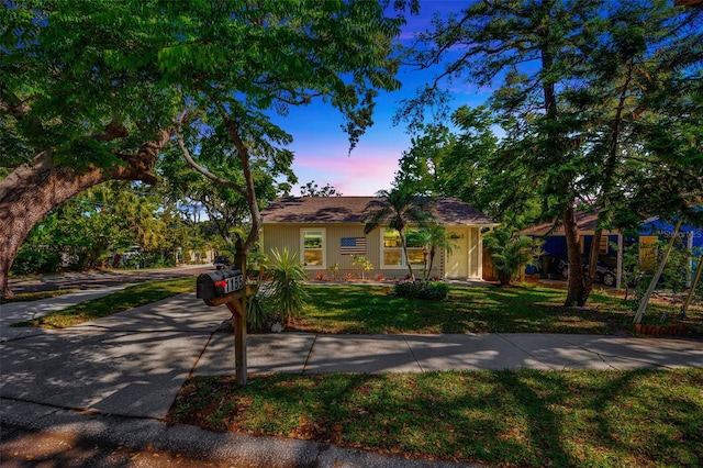 1155 Withlacoochee St, Safety Harbor, FL 34695 - view of front of house with driveway and a front lawn