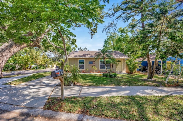 1155 Withlacoochee St, Safety Harbor, FL 34695 - view of front of house featuring concrete driveway and a front lawn