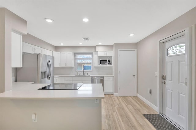 1155 Withlacoochee St, Safety Harbor, FL 34695 - kitchen with light countertops, plenty of natural light, visible vents, and appliances with stainless steel finishes