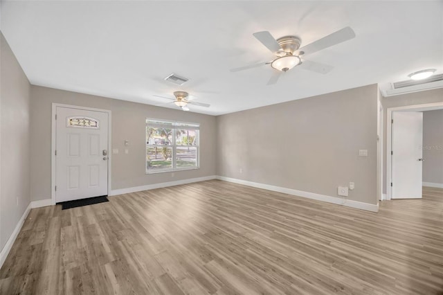1155 Withlacoochee St, Safety Harbor, FL 34695 - foyer entrance with a ceiling fan, visible vents, light wood-style flooring, and baseboards