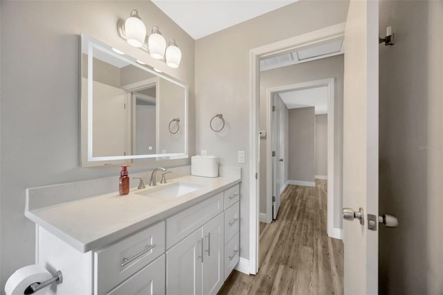 1155 Withlacoochee St, Safety Harbor, FL 34695 - bathroom with wood finished floors, vanity, and baseboards