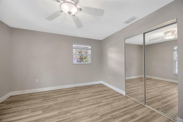 1155 Withlacoochee St, Safety Harbor, FL 34695 - unfurnished bedroom featuring wood finished floors, visible vents, and baseboards