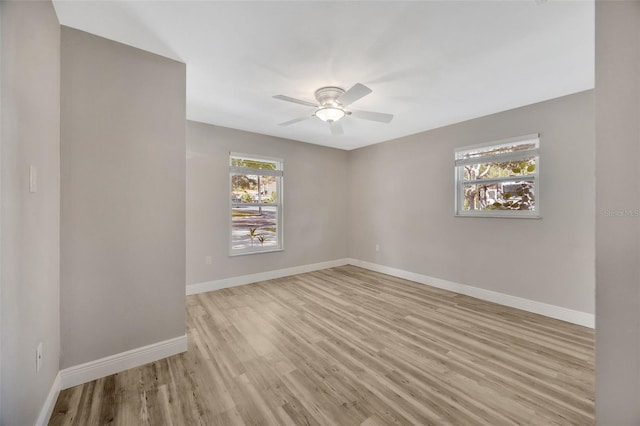 1155 Withlacoochee St, Safety Harbor, FL 34695 - unfurnished room featuring wood finished floors and baseboards