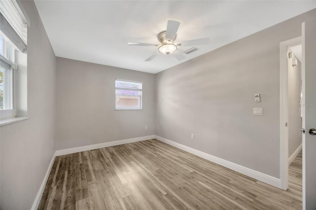 1155 Withlacoochee St, Safety Harbor, FL 34695 - spare room with ceiling fan, light wood-style flooring, and baseboards