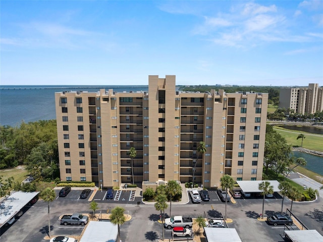 2616 Cove Cay Dr Unit 803, Clearwater, FL 33760 - view of apartment building / complex with a water view and uncovered parking