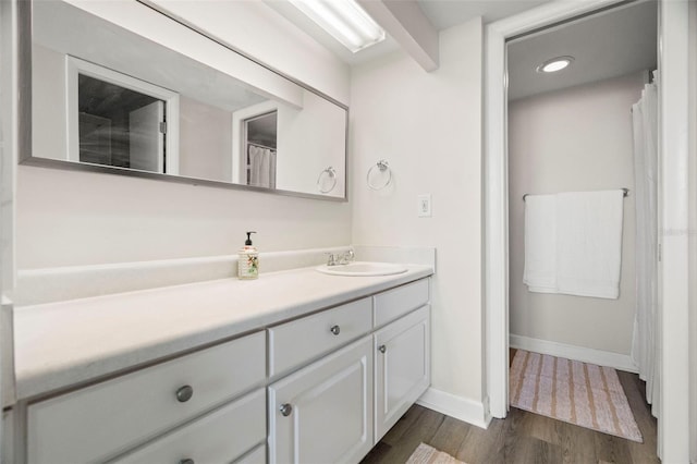 2616 Cove Cay Dr Unit 803, Clearwater, FL 33760 - bathroom with vanity, wood finished floors, and baseboards