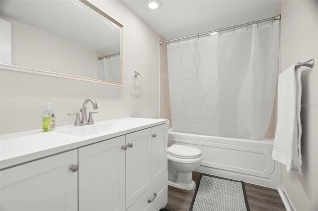 2616 Cove Cay Dr Unit 803, Clearwater, FL 33760 - bathroom featuring vanity, toilet, wood finished floors, shower / bath combination with curtain, and recessed lighting