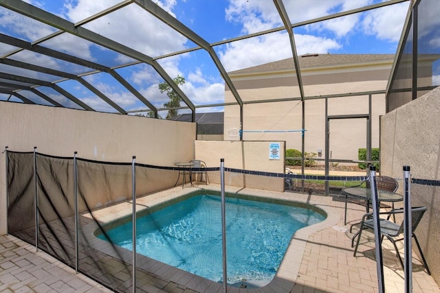 view of swimming pool with a lanai, a fenced in pool, and a patio area