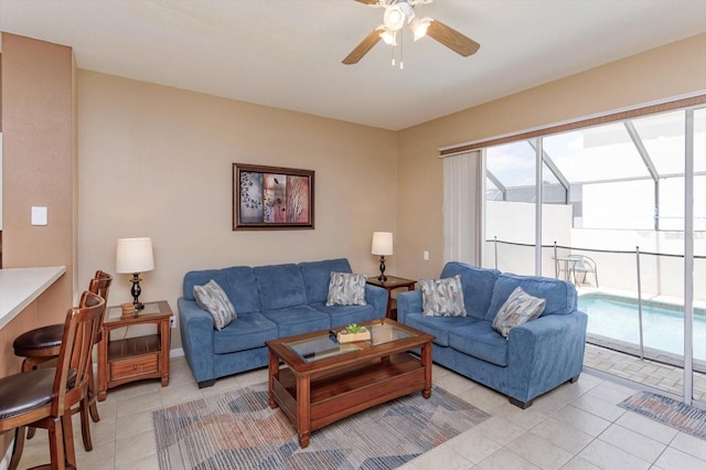 living room with light tile patterned floors and a ceiling fan
