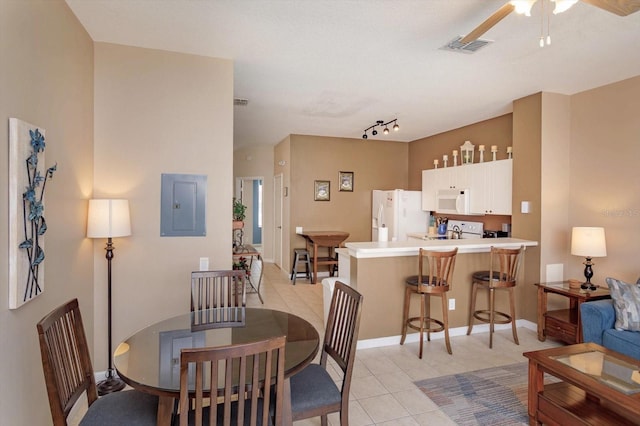 dining area featuring electric panel, baseboards, visible vents, a ceiling fan, and light tile patterned flooring