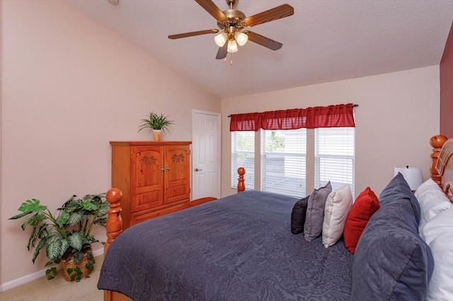 bedroom with a ceiling fan, baseboards, lofted ceiling, and carpet floors