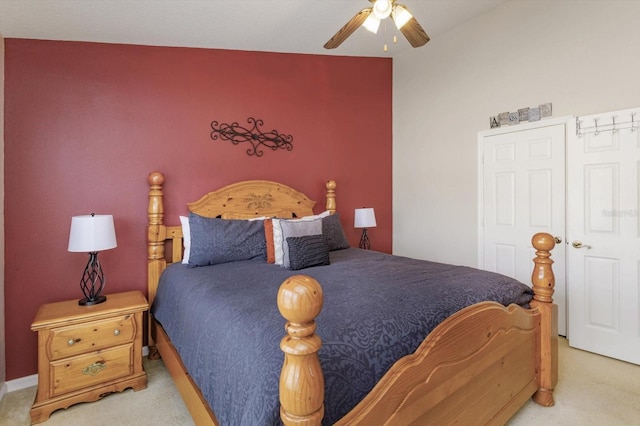 bedroom with light colored carpet and ceiling fan