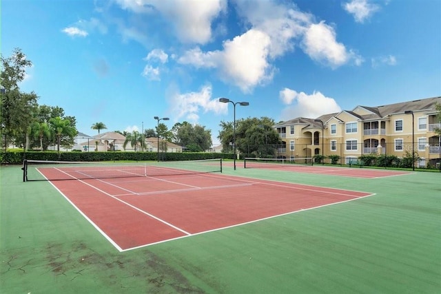 view of sport court featuring fence and community basketball court