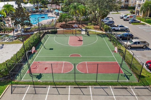 view of basketball court featuring community basketball court and fence