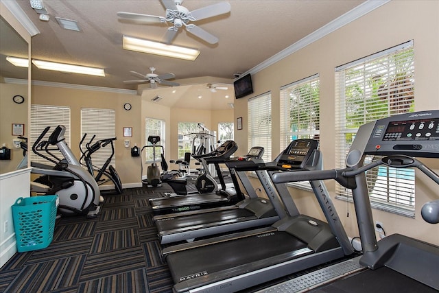 workout area with visible vents, a ceiling fan, ornamental molding, and baseboards