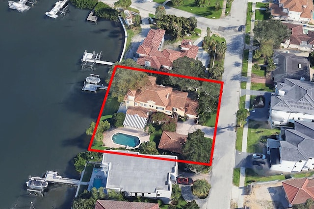 birds eye view of property with a residential view and a water view