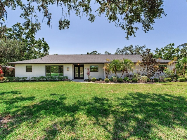 6310 95th St E, Bradenton, FL 34202 - ranch-style house with french doors and a front yard