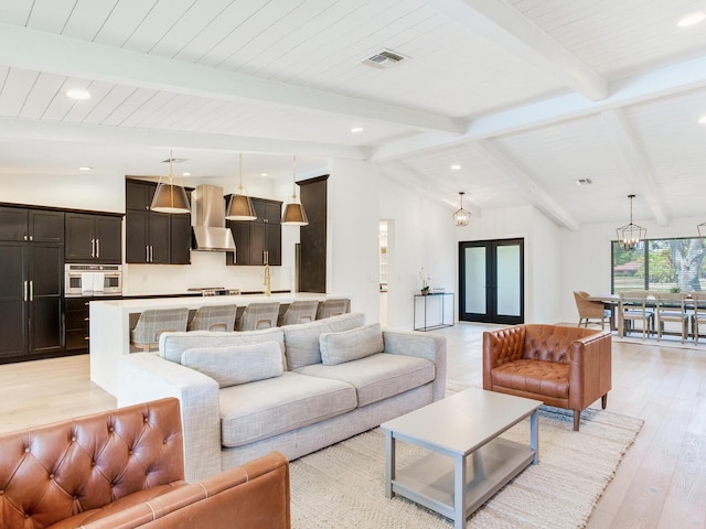 6310 95th St E, Bradenton, FL 34202 - living area with recessed lighting, visible vents, lofted ceiling with beams, and light wood finished floors