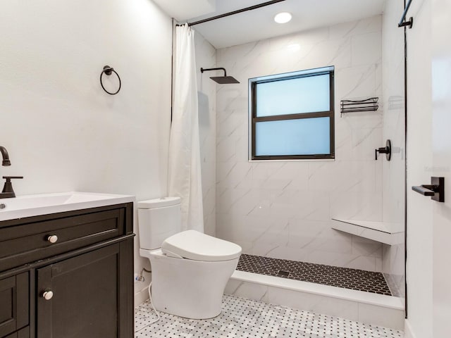 6310 95th St E, Bradenton, FL 34202 - bathroom with vanity, a tile shower, and toilet