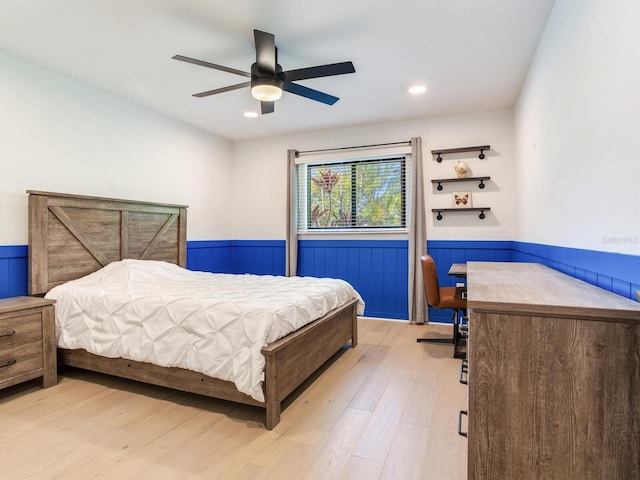 6310 95th St E, Bradenton, FL 34202 - bedroom featuring a wainscoted wall, a ceiling fan, recessed lighting, and light wood-style flooring