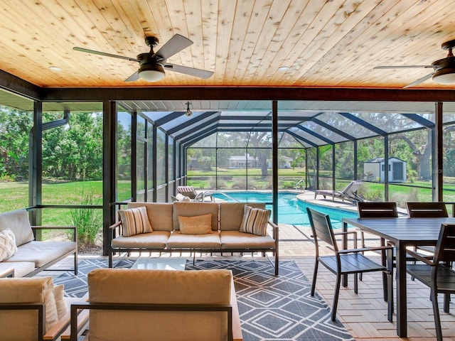 6310 95th St E, Bradenton, FL 34202 - sunroom / solarium with plenty of natural light, outdoor dining area, ceiling fan, and outdoor lounge area
