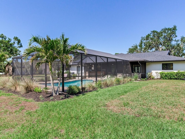 6310 95th St E, Bradenton, FL 34202 - back of property with a yard, a lanai, and an outdoor pool