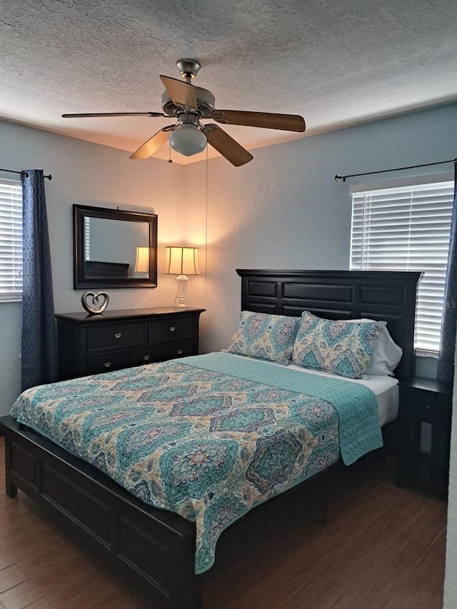 7503 N Howard Ave, Tampa, FL 33604 - bedroom with a ceiling fan, a textured ceiling, a textured wall, and wood finished floors