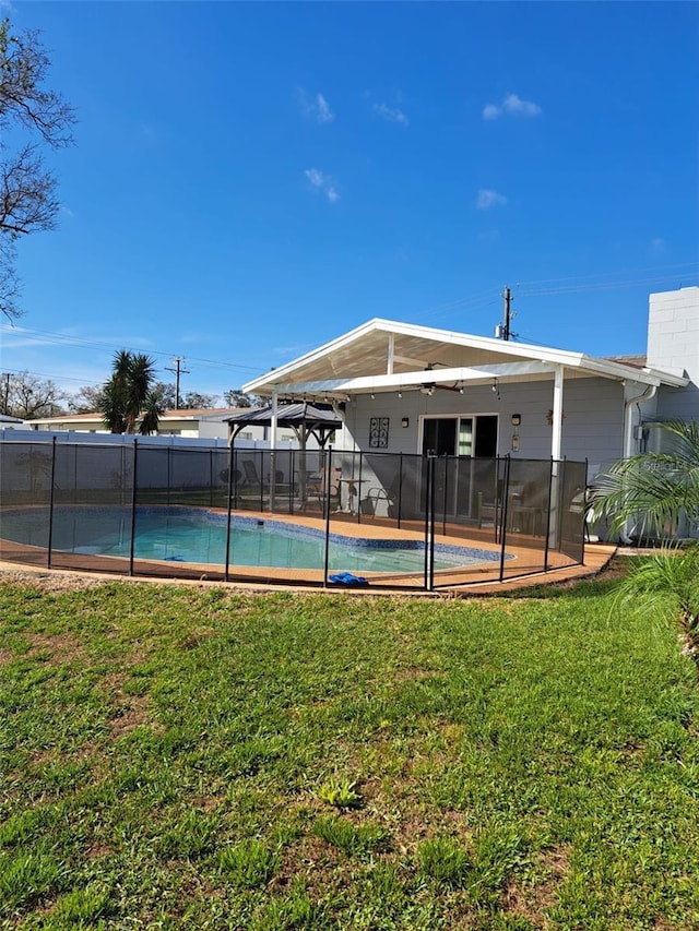 7503 N Howard Ave, Tampa, FL 33604 - view of pool with a fenced in pool, fence, and a yard