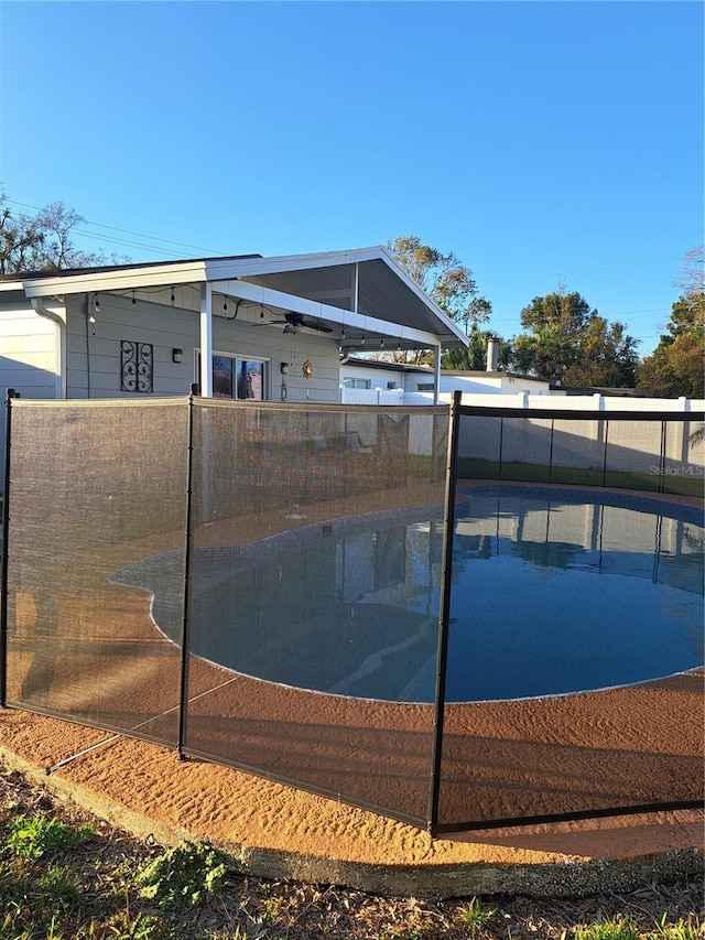 7503 N Howard Ave, Tampa, FL 33604 - view of basketball court featuring fence and a fenced in pool