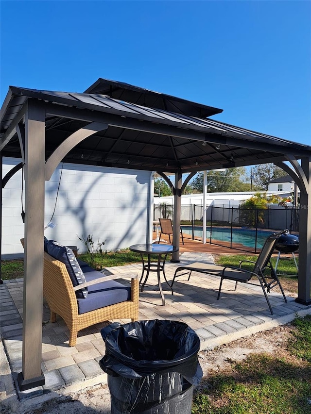 7503 N Howard Ave, Tampa, FL 33604 - view of patio / terrace with fence, a gazebo, a fenced in pool, and an outdoor fire pit