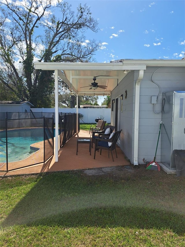 7503 N Howard Ave, Tampa, FL 33604 - view of patio / terrace featuring a fenced in pool, a ceiling fan, and a fenced backyard