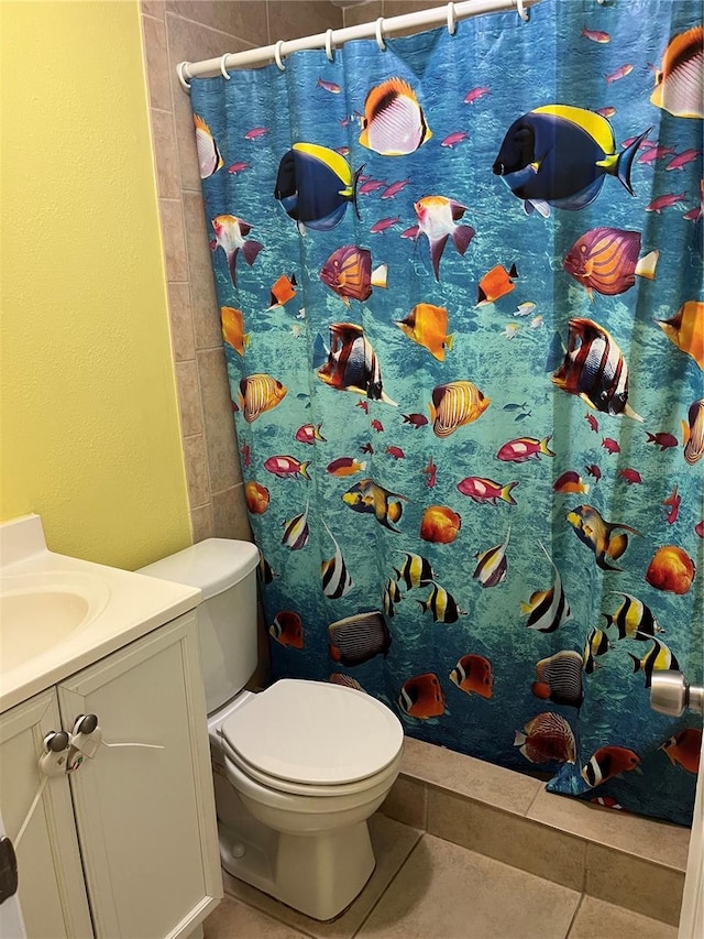 7503 N Howard Ave, Tampa, FL 33604 - bathroom with tile patterned floors, vanity, toilet, and a shower with shower curtain