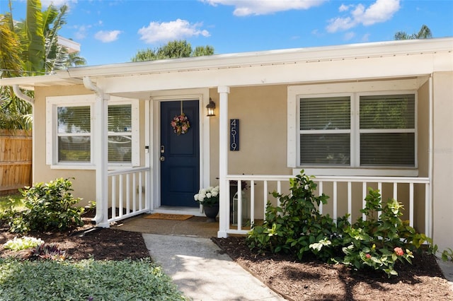 4519 S Grady Ave, Tampa, FL 33611 - property entrance with stucco siding and covered porch