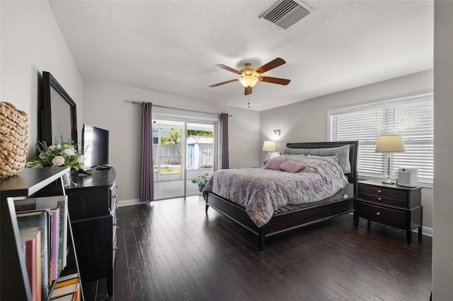 4519 S Grady Ave, Tampa, FL 33611 - bedroom featuring access to outside, a textured ceiling, dark wood-style flooring, ceiling fan, and baseboards