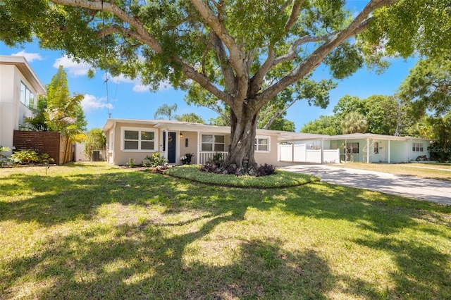 4519 S Grady Ave, Tampa, FL 33611 - ranch-style house with driveway, stucco siding, and cooling unit